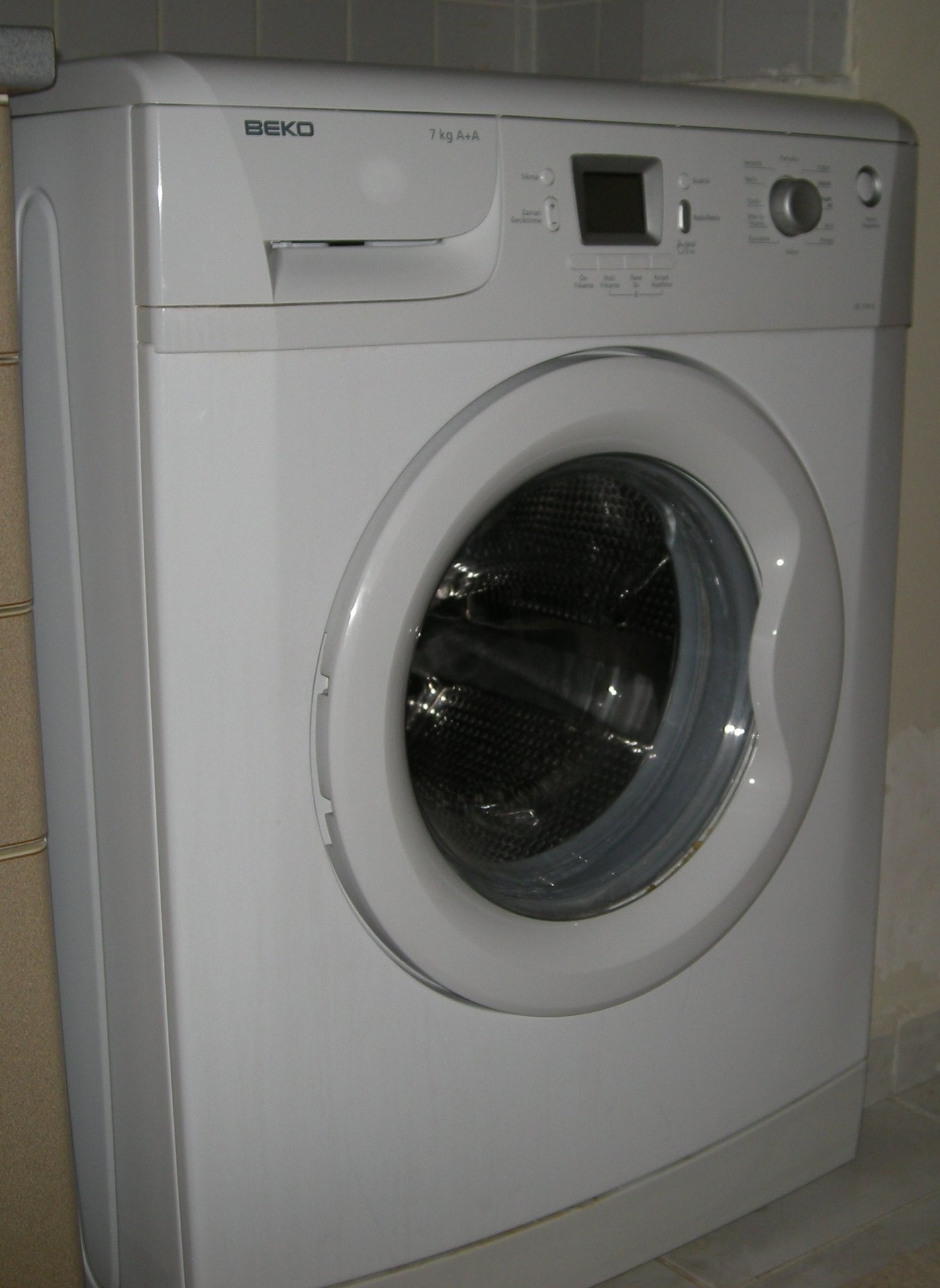 A white front-loading washing machine, shown for illustration.